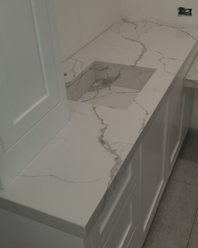 High-gloss granite shower walls and flooring